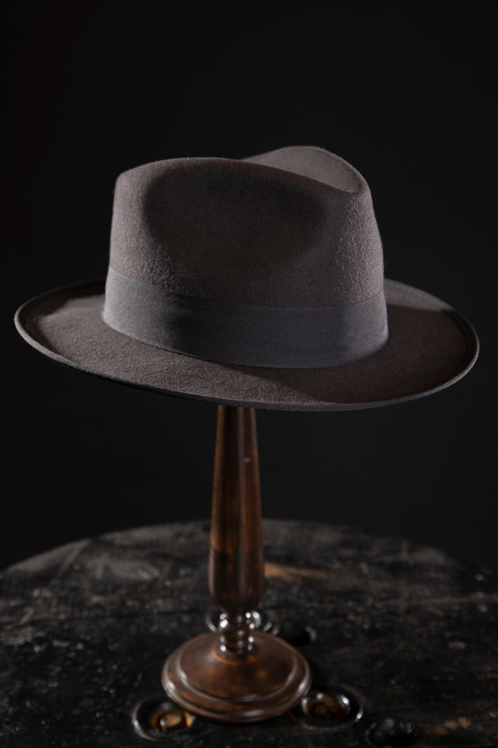 Woolen Fedora Grey - Deluxe, high-quality hats for men and women. Our collection of hats including wool felt top hats, fedoras, bowlers, caps, fedoras, trilbys, cloches and more are a wonderful addition to a 1920s Gangster or Gatsby costume, or the perfect fashion accessory. Shop online, or visit our Mornington hat store to see all that we have to offer.