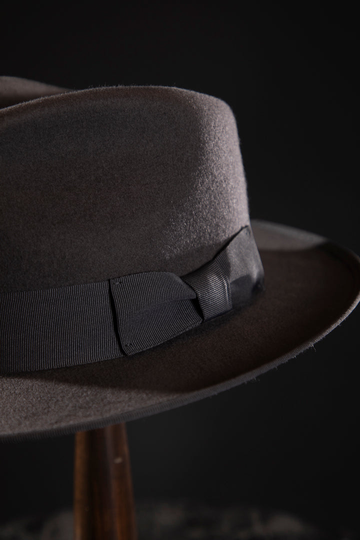 Woolen Fedora Grey - Deluxe, high-quality hats for men and women. Our collection of hats including wool felt top hats, fedoras, bowlers, caps, fedoras, trilbys, cloches and more are a wonderful addition to a 1920s Gangster or Gatsby costume, or the perfect fashion accessory. Shop online, or visit our Mornington hat store to see all that we have to offer.