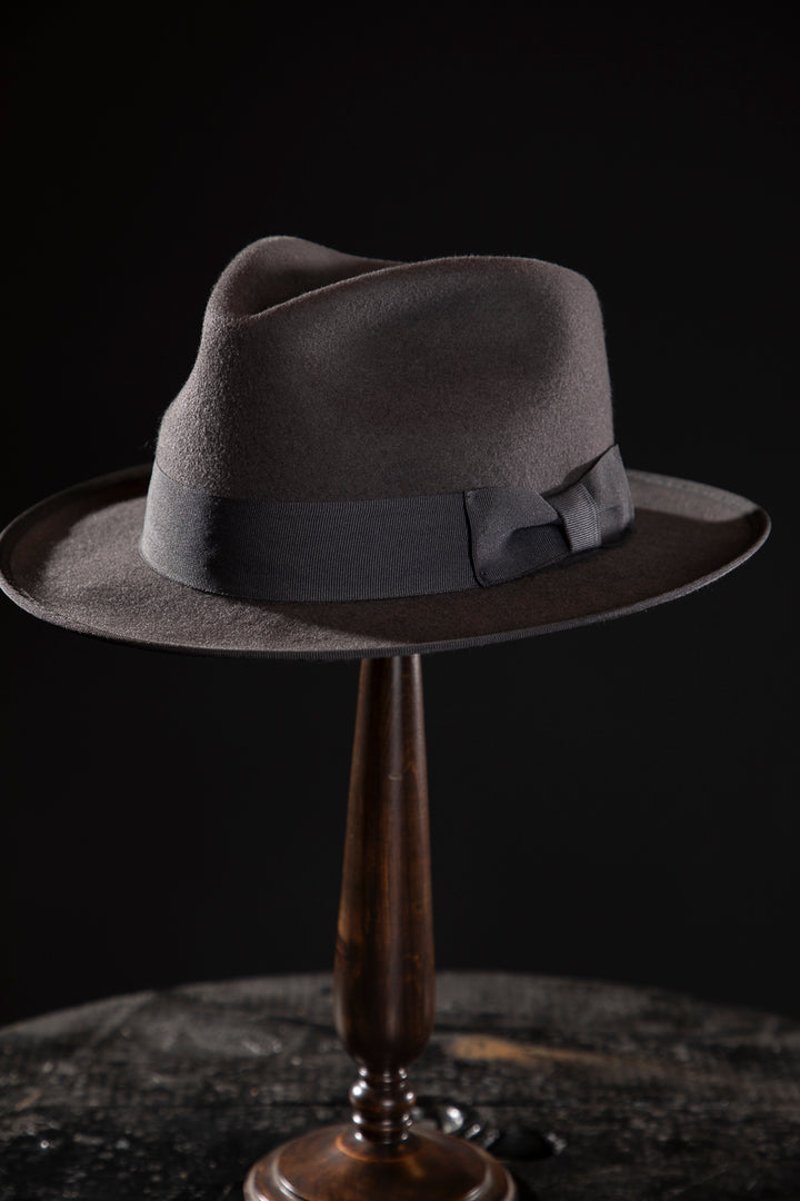 Woolen Fedora Grey - Deluxe, high-quality hats for men and women. Our collection of hats including wool felt top hats, fedoras, bowlers, caps, fedoras, trilbys, cloches and more are a wonderful addition to a 1920s Gangster or Gatsby costume, or the perfect fashion accessory. Shop online, or visit our Mornington hat store to see all that we have to offer.