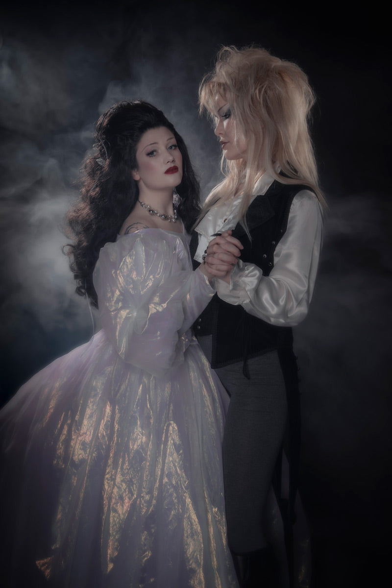 The Goblin King Jareth and Sarah from The Labyrinth in styled replica costumes, photographed at Little Shop of Horrors Costumery & Pop-Culture Emporium.