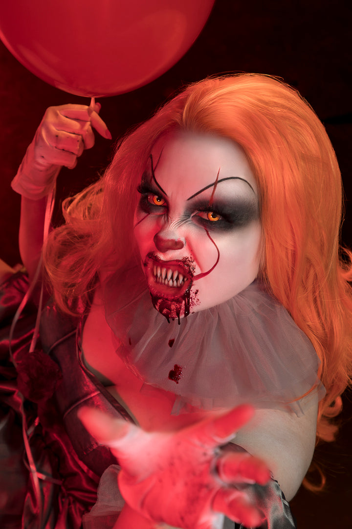 Welcome to Derry Ladies Sexy Pennywise Costume with Lace Front Wig, plus cinematic character makeup and Horror Photography available at Little Shop of Horrors Costumery & Pop-Culture Emporium, Mornington, Frankston, Melbourne, Australia. www.littleshopofhorrors.com.au