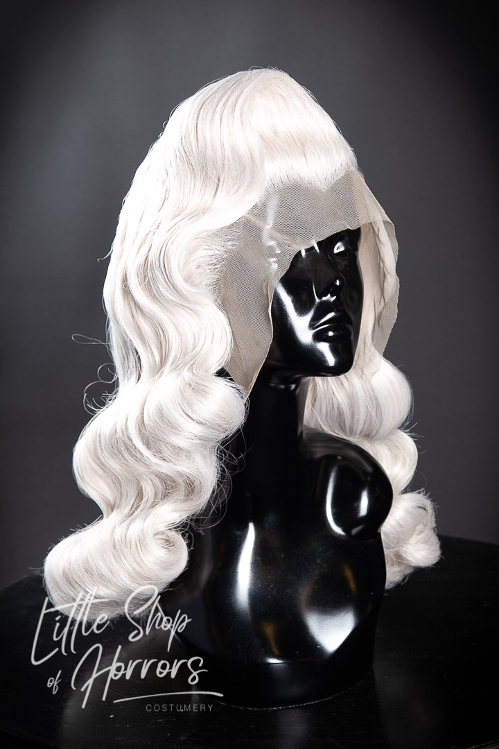 Introducing our mesmerizing "Kiss the Boys Goodbye" styled lace front wig, a breathtaking vintage creation adorned with luxuriously soft waves that cascade elegantly to create a truly stunning look. Little Shop of Horrors Costumery & Pop-Culture Emporium 6/1 Watt Rd Mornington Melbourne Australia