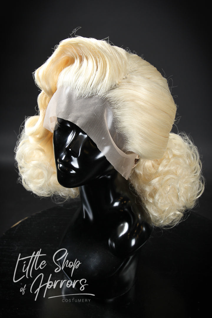 Introducing our beautiful "Stormy Weather" styled lace front wig, an n exquisite 1930s vintage set, featuring a beautiful marcel wave at the front delicately finished with fluffy curls. Available to order at Little Shop of Horrors Costumery & Pop Culture Emporium, Melbourne's Wig Styling Specialists. 6/1 Watt Rd Mornington.