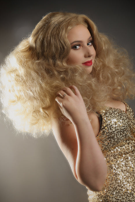 Get ready to set the dance floor on fire with our "Disco Fever" styled lace front wig! This wig embodies everything a Studio 54-loving wig from the 1970s should be—big, bold, and bursting with luxurious curls. Available to order at Little Shop of Horrors Costumery & Pop Culture Emporium, Melbourne's Wig Styling Specialists. 6/1 Watt Rd Mornington.
