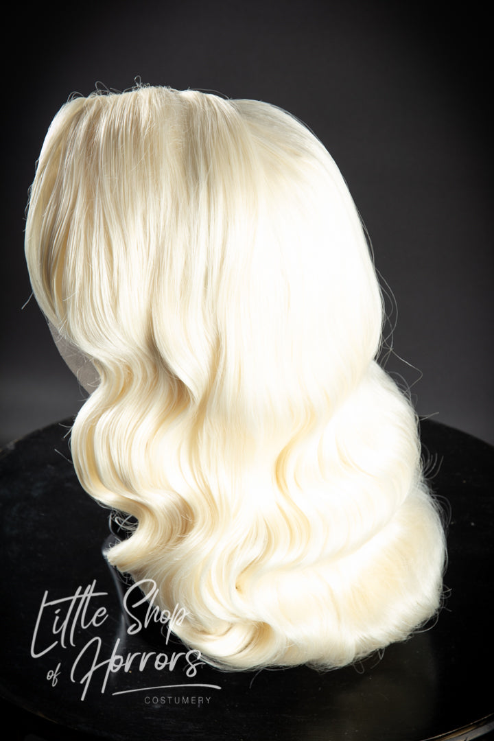 Introducing our mesmerizing "Why Don't You Do Right" styled lace front wig, a vintage masterpiece featuring luxuriously soft waves that cascade elegantly. This breathtaking creation exudes the captivating allure of a sultry jazz singer, ensuring you radiate with stunning glamour.